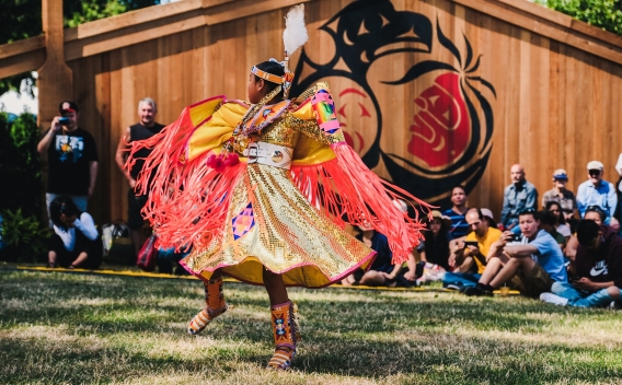 Indigenous girl dancing in full regalia
