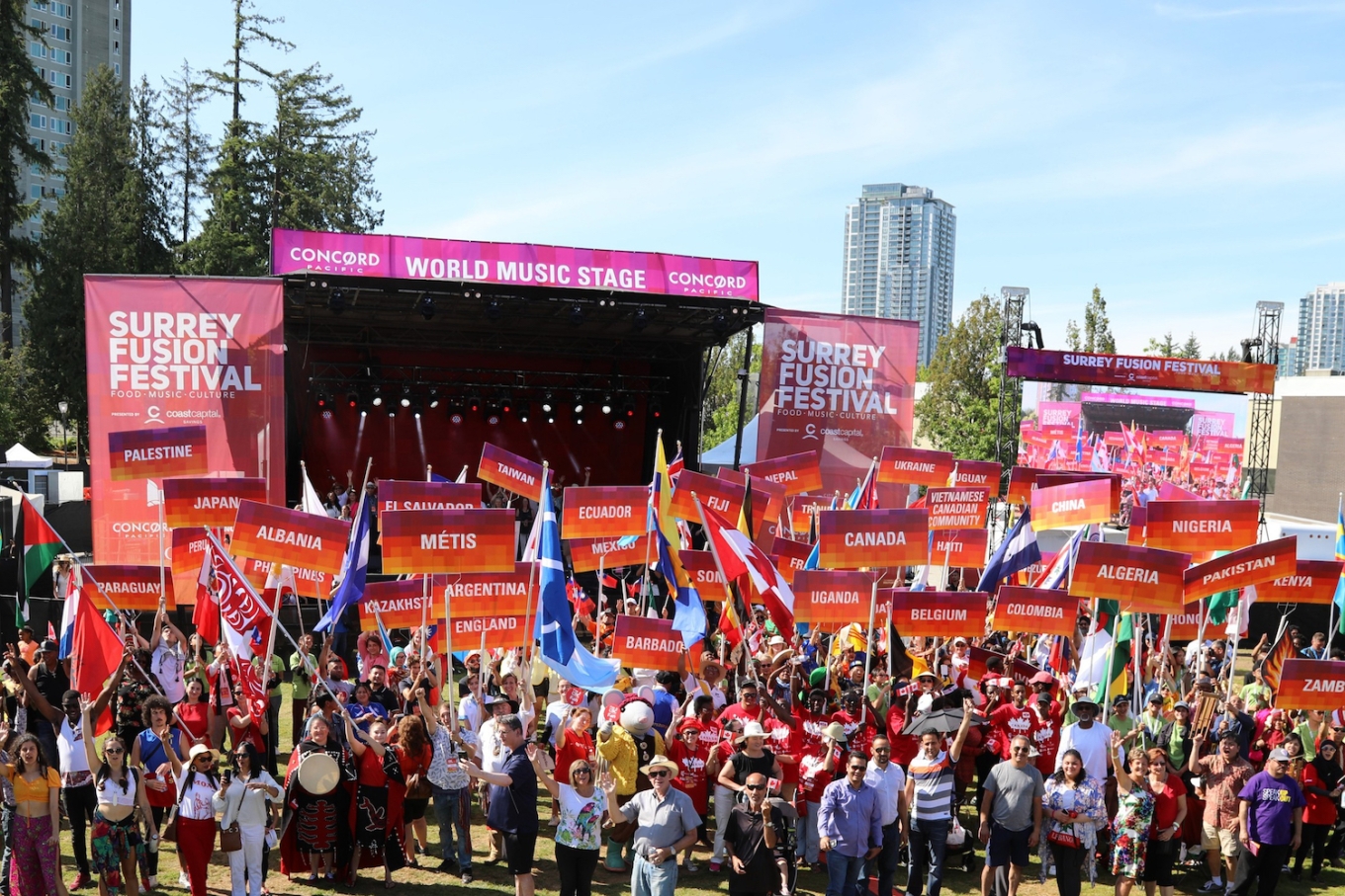 Crowd of festival organizers with pavilion signs